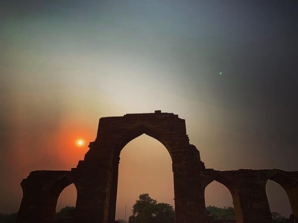 A sunset above some ruins in New Dehli