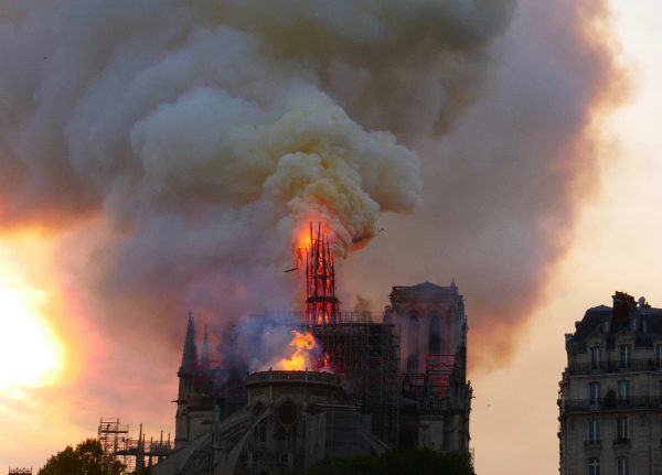 The spire following of Notre Dame de Paris during the fire