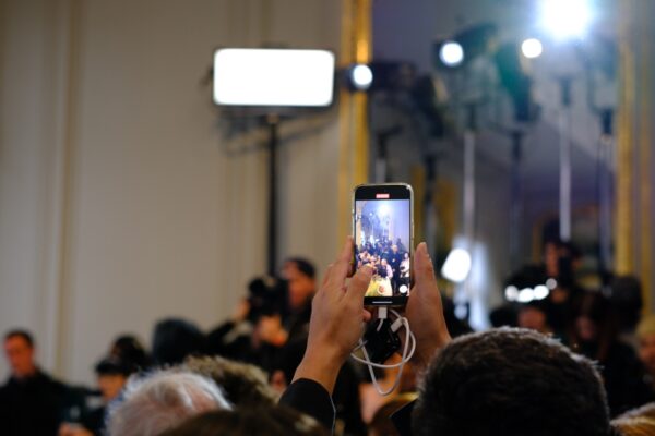 The screen of a phone during the fashion show